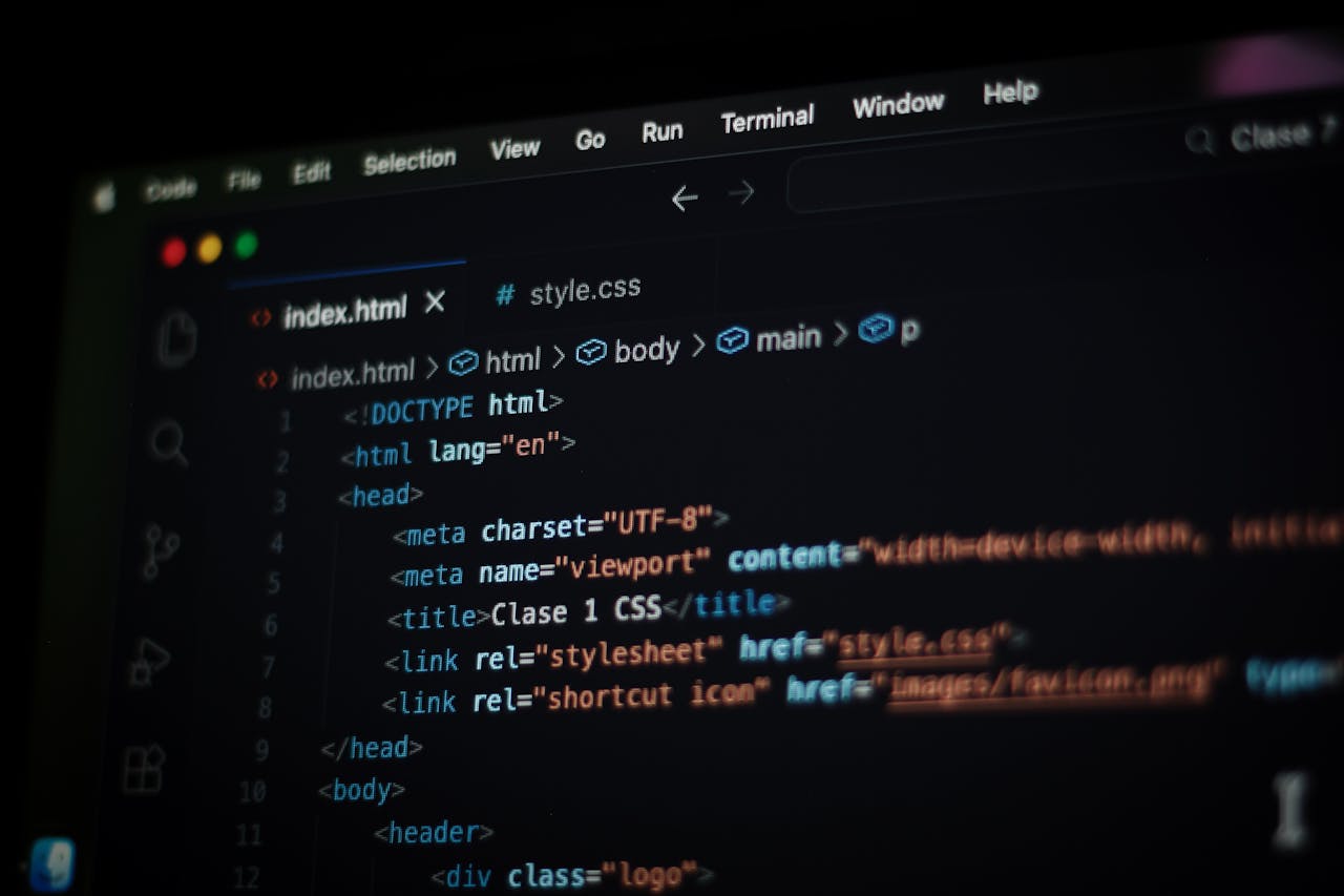Close-up of HTML code displayed on a computer screen in dark mode, focusing on programming concepts.